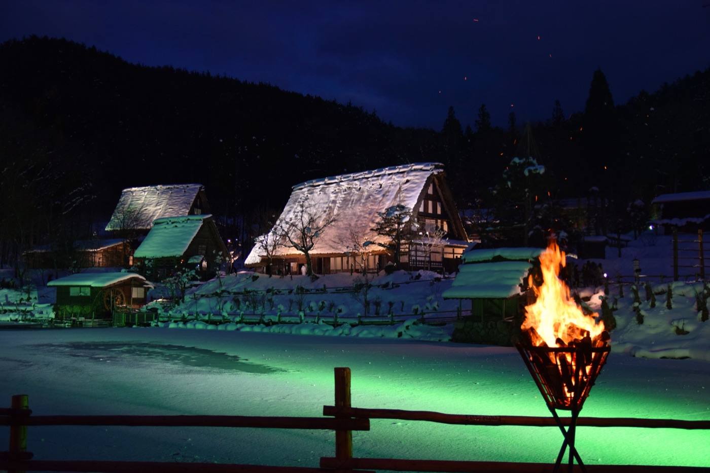 thatched houses and a pond at the Hida Folk Village