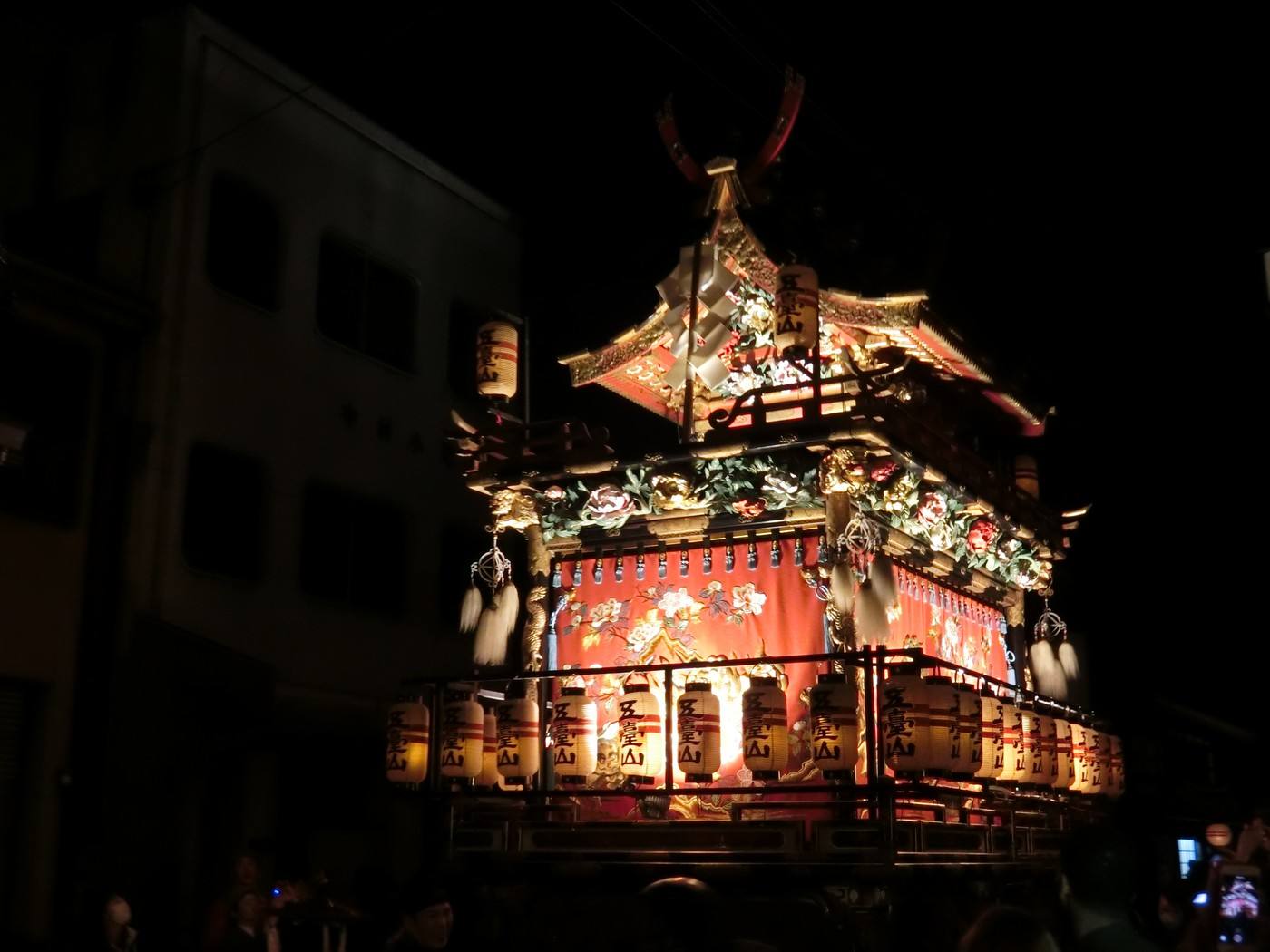 a lantern-lit float at the Takayama festival at night