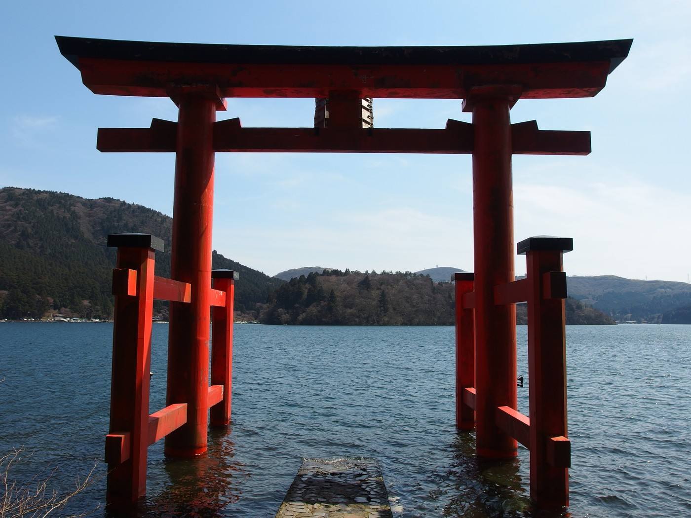 the red torii standing in Lake Ashi at Hakone