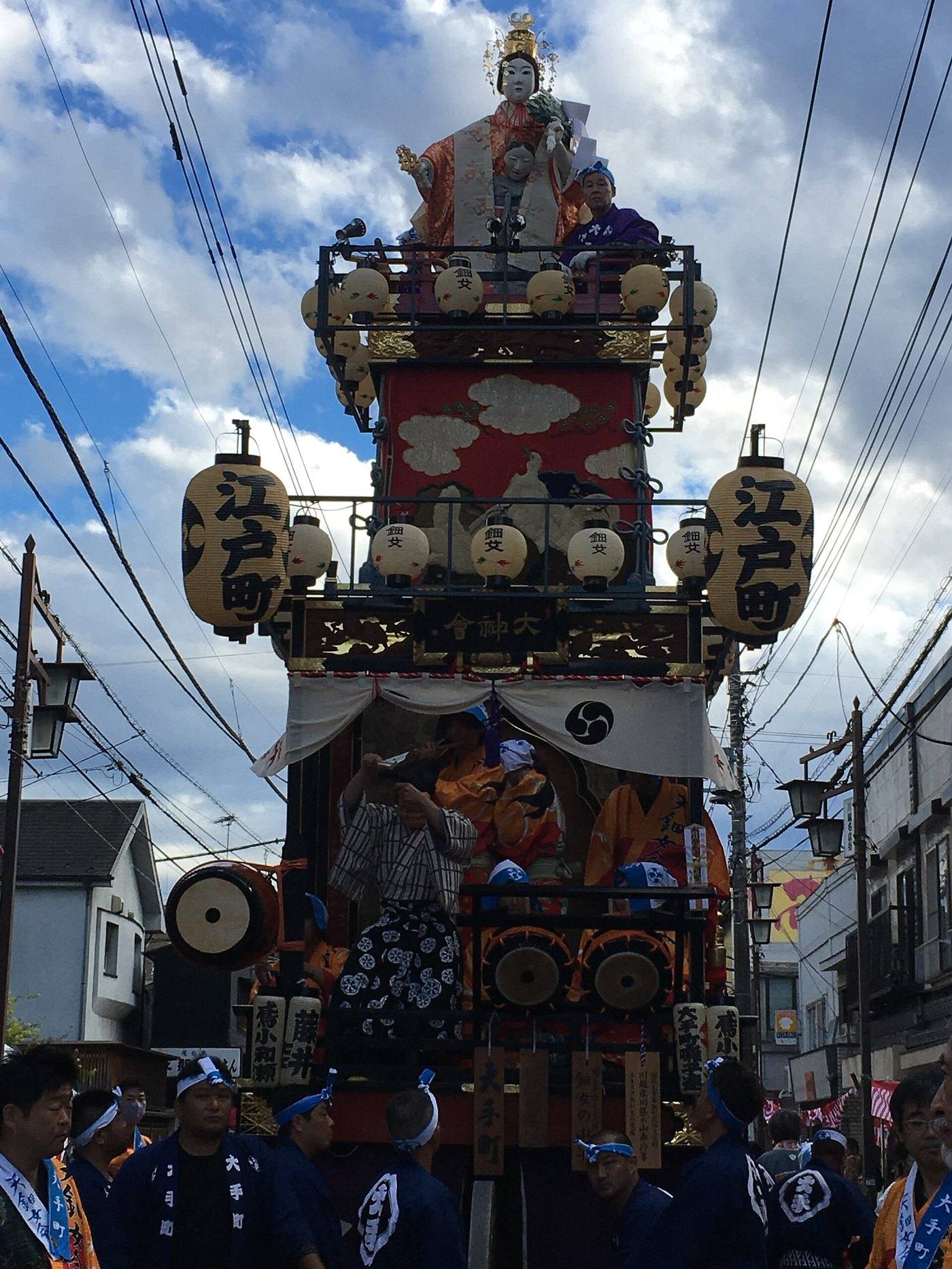 a festival float carried through the street