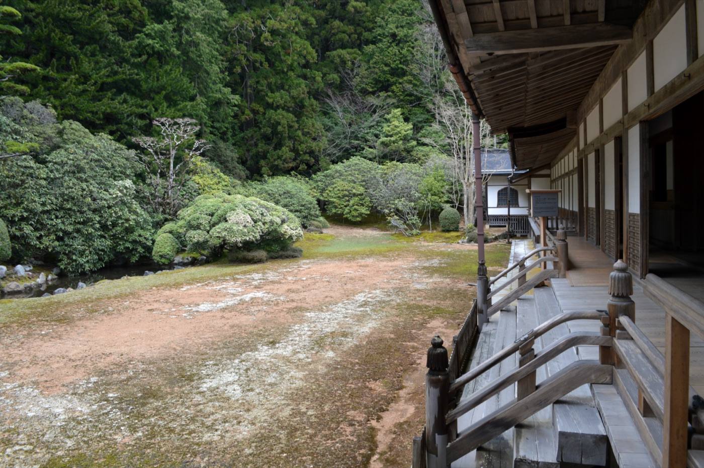the veranda and garden of a temple lodging