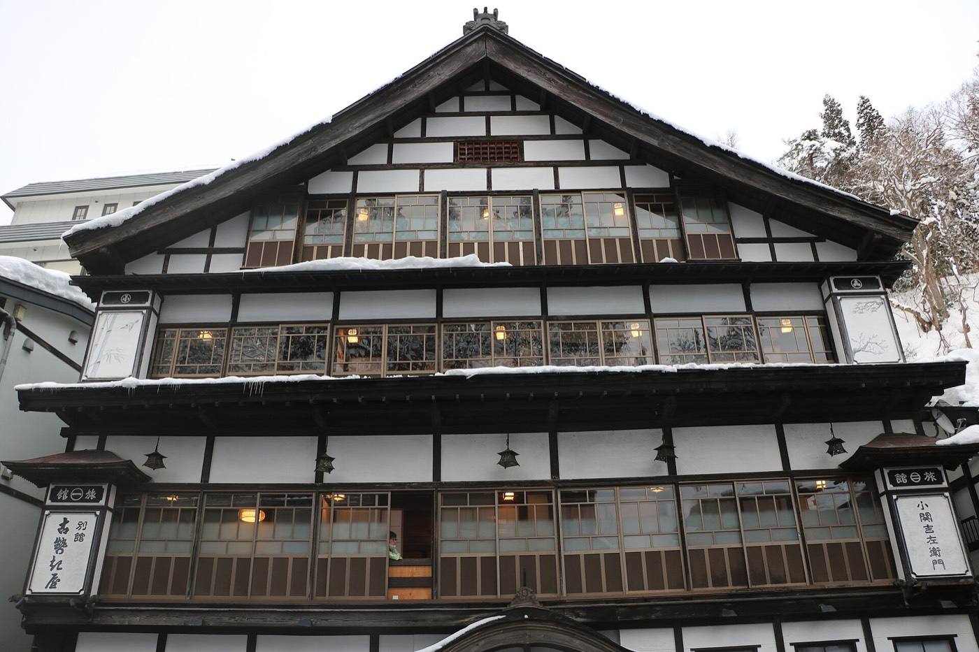 wooden inns in a hot spring town under snow