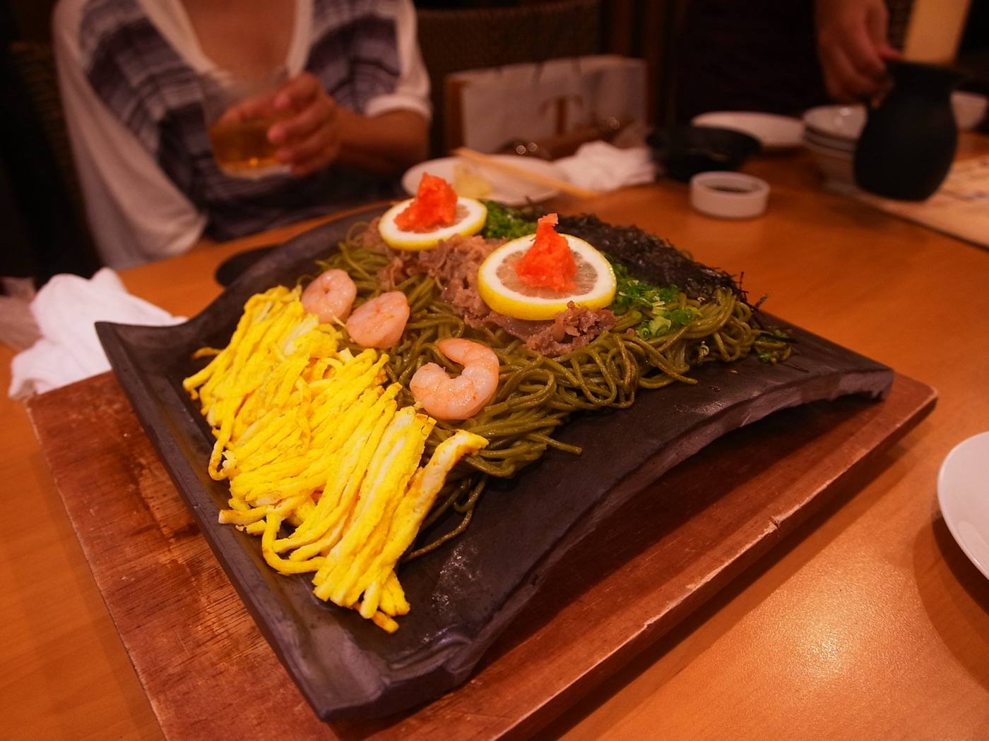kawara soba, tea noodles grilled on a roof tile